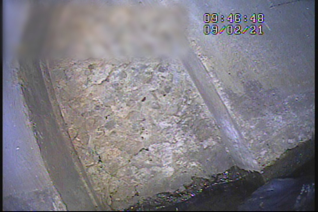Competitor camera frame of a submerged concrete face