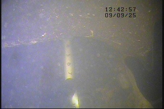 Competitor camera frame of a folding ruler held against a submerged member